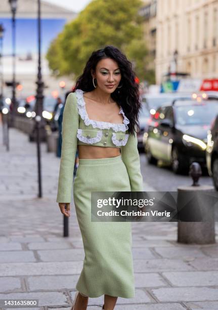 Jessica Wang wears green cropped jacket with ruffled white element, pockets, tube skirt, platform shoe outside Alessandra Rich during Paris Fashion...