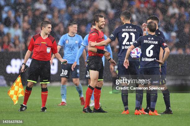 Referee Chris Beath receives attention after colliding with Rhyan Grant of Sydney FC during the round one A-League Men's match between Sydney FC and...