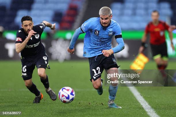 Patrick Wood of Sydney FC dribbles the ball during the round one A-League Men's match between Sydney FC and Melbourne Victory at Allianz Stadium, on...