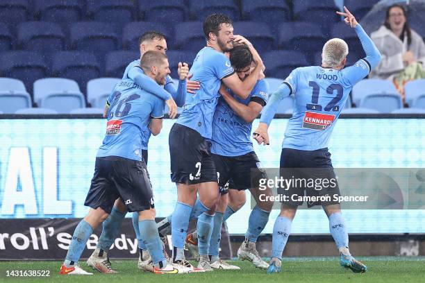 James Donachie of Sydney FC celebrates scoring a goal with team mates during the round one A-League Men's match between Sydney FC and Melbourne...