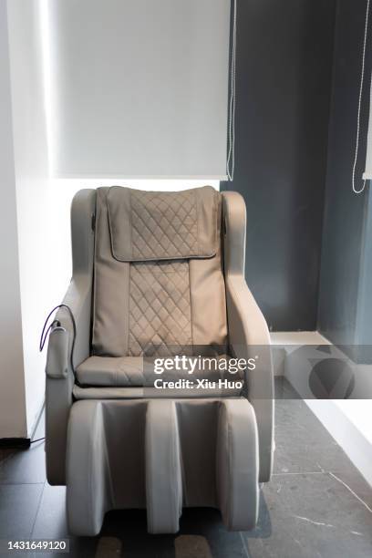 massage chairs in the lounge - massagestuhl stock-fotos und bilder