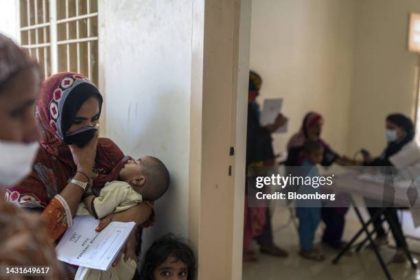 Patients wait for a check-up during a medical camp set up by Medecins Sans Frontières , also known as Doctors Without Borders, at a rural health...