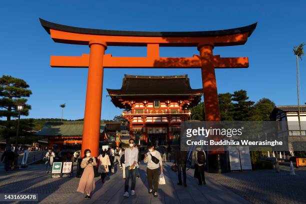 Tourists visit at Fushimi Inari-Taisha shrine, one of Japan's most popular tourist destinations on October 08, 2022 in Kyoto, Japan. Japan will start...