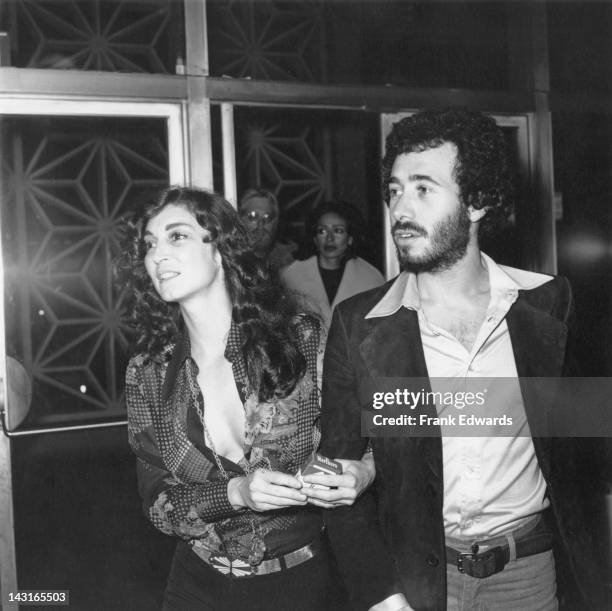 Actress Julie Payne with producer David Geffen at a screening of the film 'Shampoo', USA, 4th February 1975.