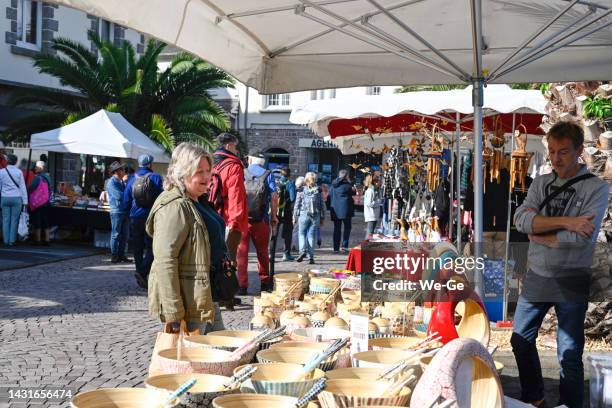 weekly market in the center of erquy, brittany - t shirtvendor stock pictures, royalty-free photos & images