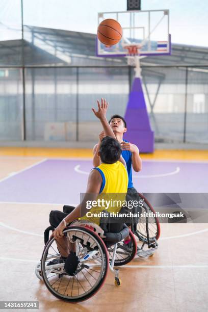 disabled basketball player on wheelchair. - handicapped adults stock-fotos und bilder