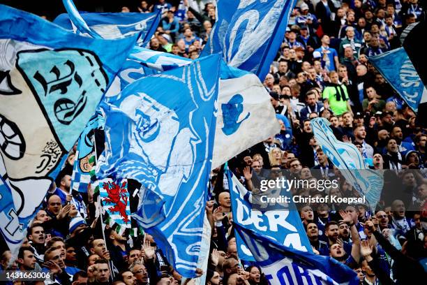 Fans of FC Schalke 04 enjoy the pre-match atmosphere with flags and banners prior to kick off of the Bundesliga match between Bayer 04 Leverkusen and...