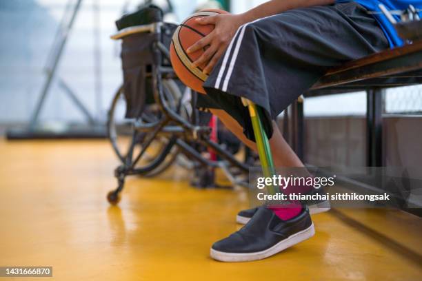 man who had paraplegic picking up basketball. - wheelchair basketball team stock pictures, royalty-free photos & images