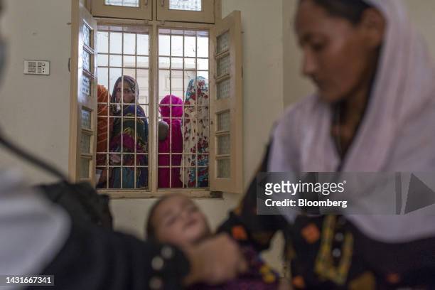 Patients wait for a check-up during a medical camp set up by Medecins Sans Frontières , also known as Doctors Without Borders, at a rural health...