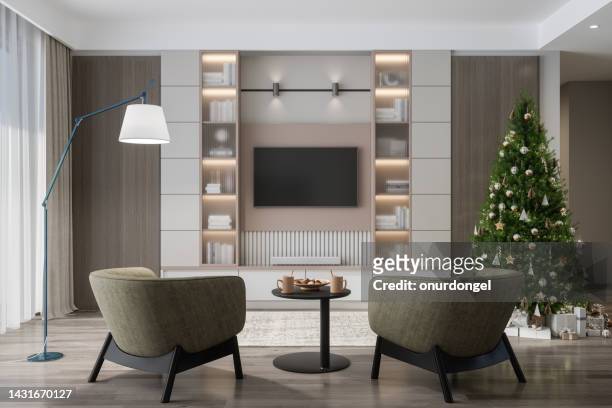 smart tv mockup with blank screen in modern living room with christmas tree, gift boxes and armchairs - smart tv living room stock pictures, royalty-free photos & images