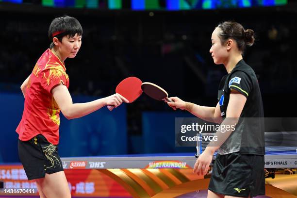 Wang Manyu of China bump rackets with Mima Ito of Japan during the Women's Final match between China and Japan on Day 9 of 2022 ITTF World Team...