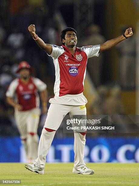 Kings XI Punjab bowler Parvinder Awana celebrates taking the wicket of Royal Challengers Bangalore batsman Mayank Agarwal during the IPL Twenty20...