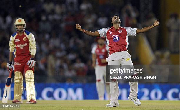 Kings XI Punjab bowler Parvinder Awana celebrates taking the wicket of Royal Challengers Bangalore batsman Mayank Agarwal during the IPL Twenty20...