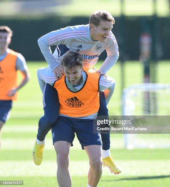 Martin Odegaard and Rob Holding of Arsenal during a training session at London Colney on October 08, 2022 in St Albans, England.