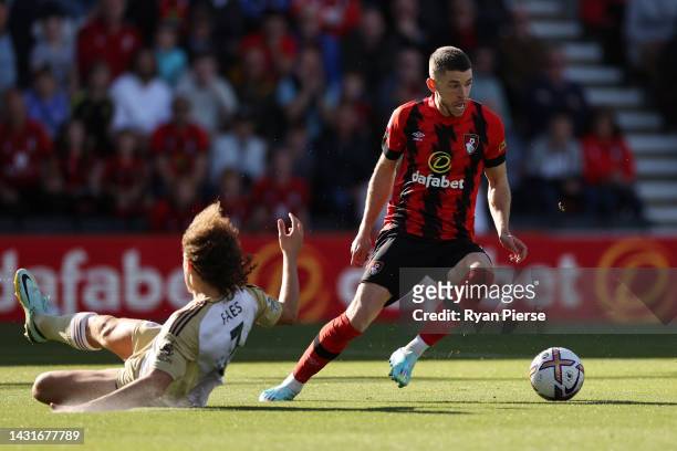 Ryan Christie of AFC Bournemouth controls the ball as Wout Faes of Leicester City misses a tackle during the Premier League match between AFC...