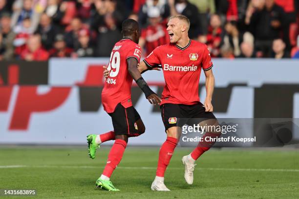 Moussa Diaby of Bayer 04 Leverkusen celebrates scoring their side's first goal Mitchel Bakker during the Bundesliga match between Bayer 04 Leverkusen...
