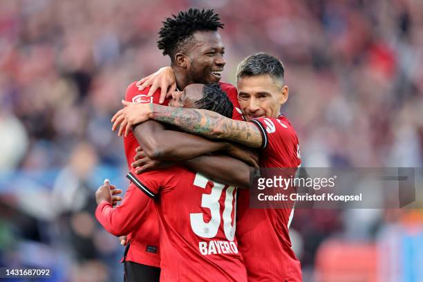 Jeremie Frimpong of Leverkusen celebrates the second goal with Edmond Tapsoba and Charles Aranguiz of Leverkusen here>> during the Bundesliga match...