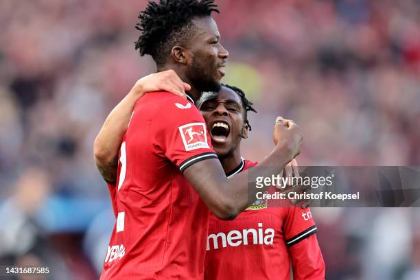Jeremie Frimpong of Leverkusen celebrates the second goal with Edmond Tapsoba of Leverkusen during the Bundesliga match between Bayer 04 Leverkusen...