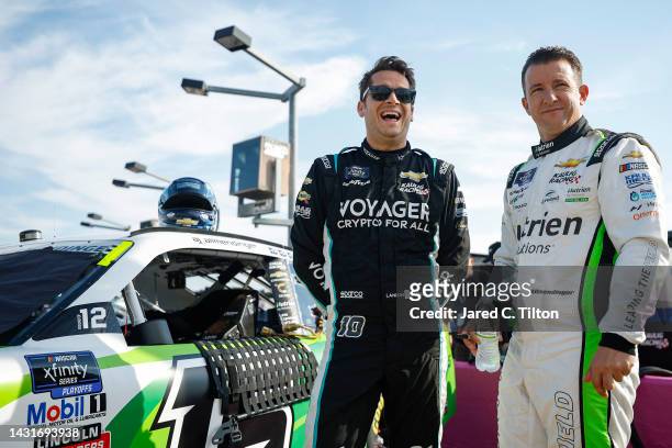 Landon Cassill, driver of the Voyager: Crypto for All Chevrolet, and AJ Allmendinger, driver of the Nutrien Ag Solutions Chevrolet, share a laugh on...