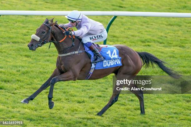 David Egan riding Run For Oscar win The Club Godolphin Cesarewitch Handicap at Newmarket Racecourse on October 08, 2022 in Newmarket, England.