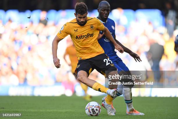 Diego Costa of Wolverhampton Wanderers battles for possession with Kalidou Koulibaly of Chelsea during the Premier League match between Chelsea FC...