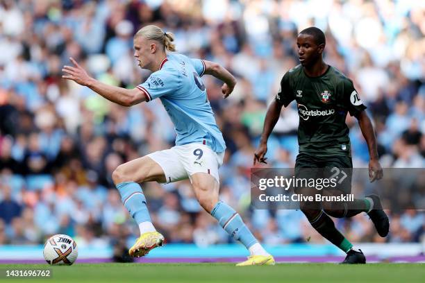 Erling Haaland of Manchester City is challenged by Ibrahima Diallo of Southampton during the Premier League match between Manchester City and...