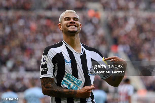 Bruno Guimaraes of Newcastle United celebrates after scoring their team's third goal during the Premier League match between Newcastle United and...