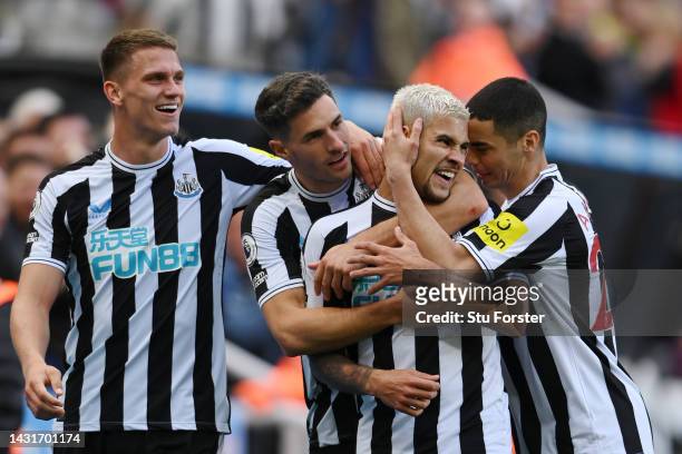 Bruno Guimaraes of Newcastle United celebrates with teammates after scoring their team's third goal during the Premier League match between Newcastle...