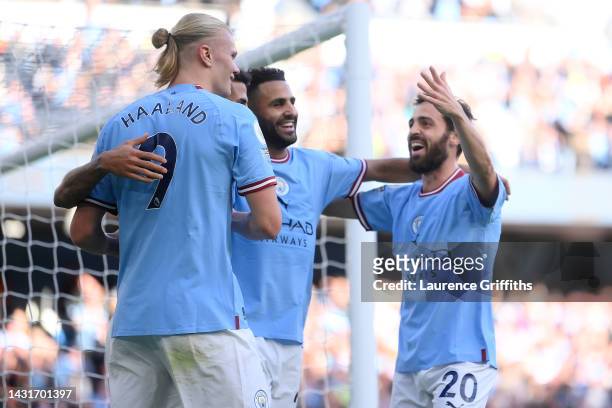 Erling Haaland of Manchester City celebrates with teammates after scoring their team's fourth goal during the Premier League match between Manchester...