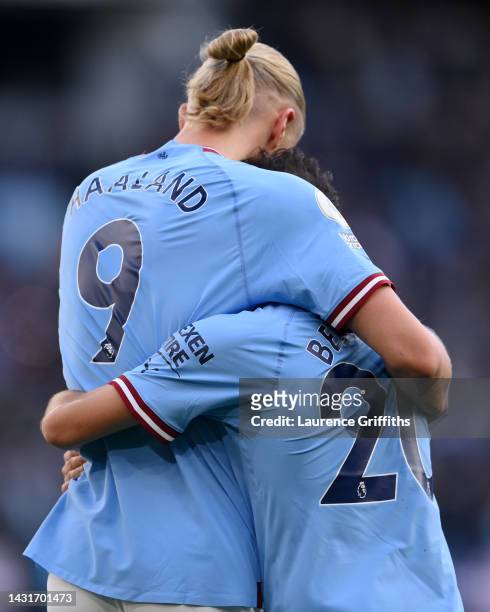 Erling Haaland celebrates with Bernardo Silva of Manchester City after scoring their team's fourth goal during the Premier League match between...