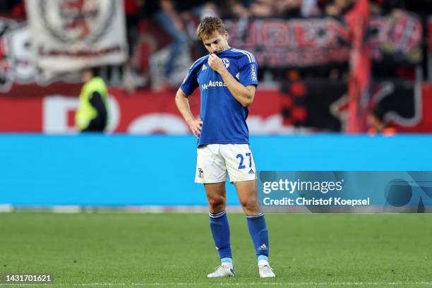 Cedric Brunner of FC Schalke 04 looks dejected after the final whistle of the Bundesliga match between Bayer 04 Leverkusen and FC Schalke 04 at...