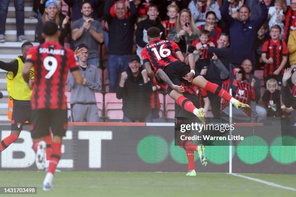 Philip Billing of AFC Bournemouth celebrates with teammate Marcus Tavernier after scoring their team's first goal during the Premier League match...