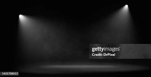 spotlights with haze over the stage - luz de escenario fotografías e imágenes de stock