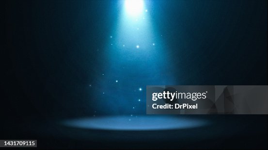 Blue Spotlight with Particles Illuminating the Stage Blue Spotlight with Particles Illuminating the Stage