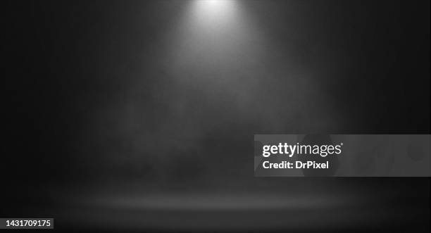 spotlight with fog over the stage - empty stage theater stock pictures, royalty-free photos & images