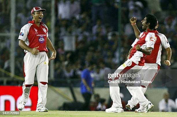 Kings XI Punjab Player Parvinder Awana celebrate the dismissal Royal Challengers Bangalore batsman Saurabh Tiwaril during IPL-5 T20 Cricket match...