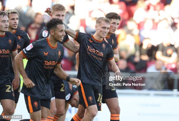 Ethan Galbraith of Salford City is congratulated by team mates after scoring his sides goal during the Sky Bet League Two between Northampton Town...