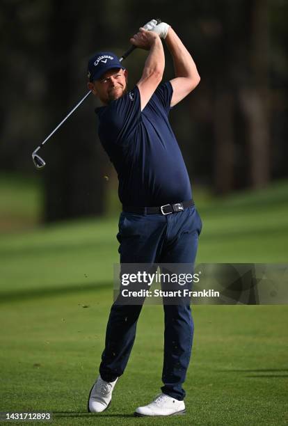 David Drysdale of Scotland plays his approach shot on the 16th hole during Day Three of the acciona Open de Espana presented by Madrid at Club de...