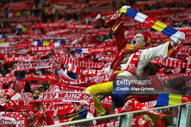 Supporters of Mainz cheer prior to the Bundesliga match between FSV Mainz 05 and VfL Wolfsburg at Coface Arena on April 20, 2012 in Mainz, Germany.