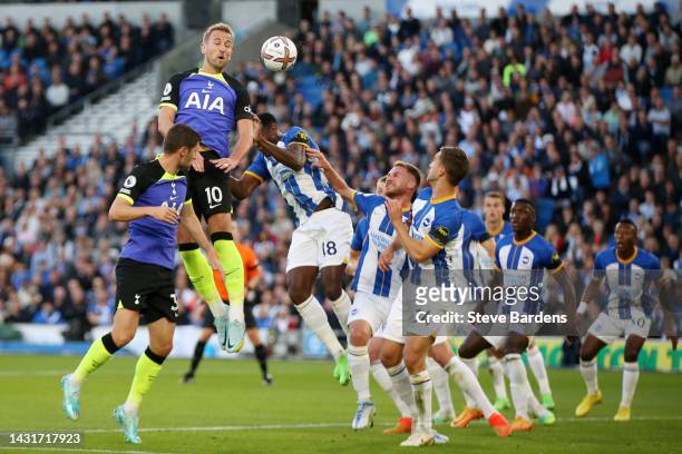 Harry Kane of Tottenham Hotspur heads the ball during the Premier League match between Brighton & Hove Albion and Tottenham Hotspur at American...
