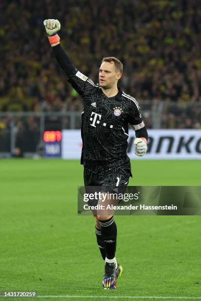 Manuel Neuer celebrates after Leon Goretzka of Bayern Munich scored their sides first goal during the Bundesliga match between Borussia Dortmund and...