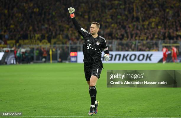 Manuel Neuer celebrates after Leon Goretzka of Bayern Munich scored their sides first goal during the Bundesliga match between Borussia Dortmund and...
