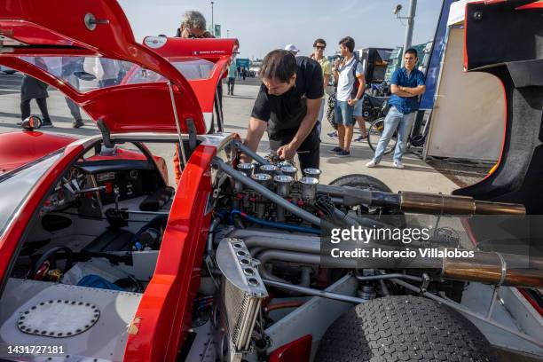 Mechanic checks a racer engine in the pit area before the start of a classic race on the 2nd day of Estoril Classics in Fernanda Pires da Silva...