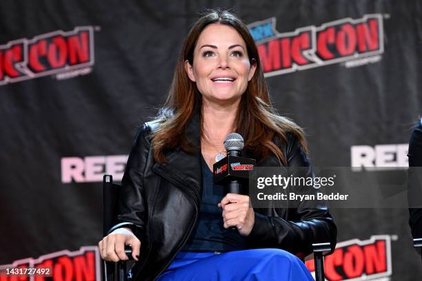 Erica Durance speaks onstage at the Smallville Cast Reunion during New York Comic Con 2022 on October 08, 2022 in New York City.