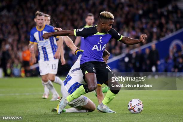 Ryan Sessegnon of Tottenham Hotspur runs with the ball from Solly March of Brighton & Hove Albion during the Premier League match between Brighton &...