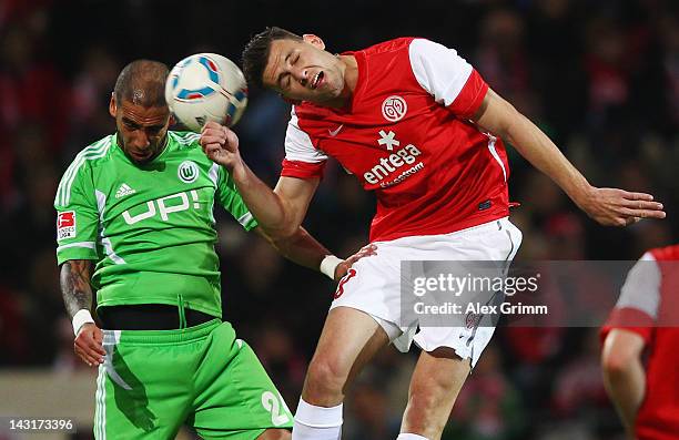 Adam Szalai of Mainz is challenged by Ashkan Dejagah of Wolfsburg during the Bundesliga match between FSV Mainz 05 and VfL Wolfsburg at Coface Arena...