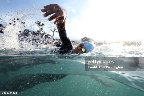 An athlete swims to the start line during the IRONMAN World Championships on October 08, 2022 in Kailua Kona, Hawaii.