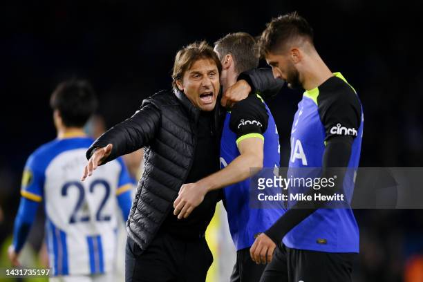 Antonio Conte celebrates with Ben Davies of Tottenham Hotspur after their sides victory during the Premier League match between Brighton & Hove...