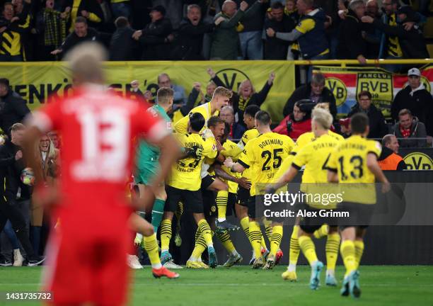 Anthony Modeste of Borussia Dortmund celebrates with teammates after scoring their team's second goal during the Bundesliga match between Borussia...