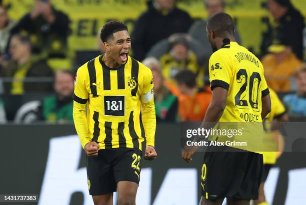 Anthony Modeste celebrates with Jude Bellingham of Borussia Dortmund after scoring their team's second goal during the Bundesliga match between...